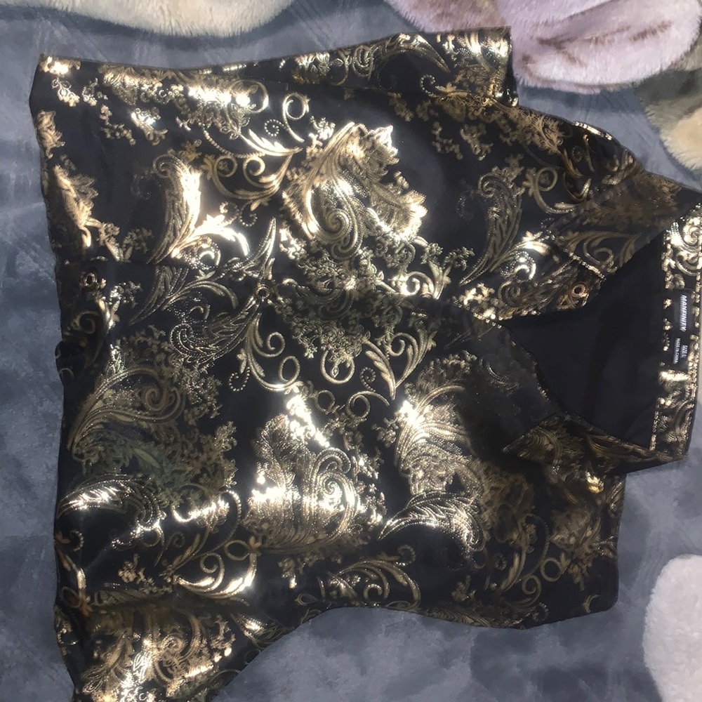 Beautiful black shirt with golden designs.